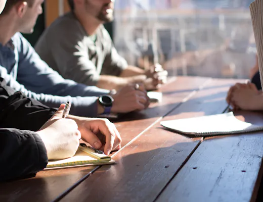 A team working on a business plan together